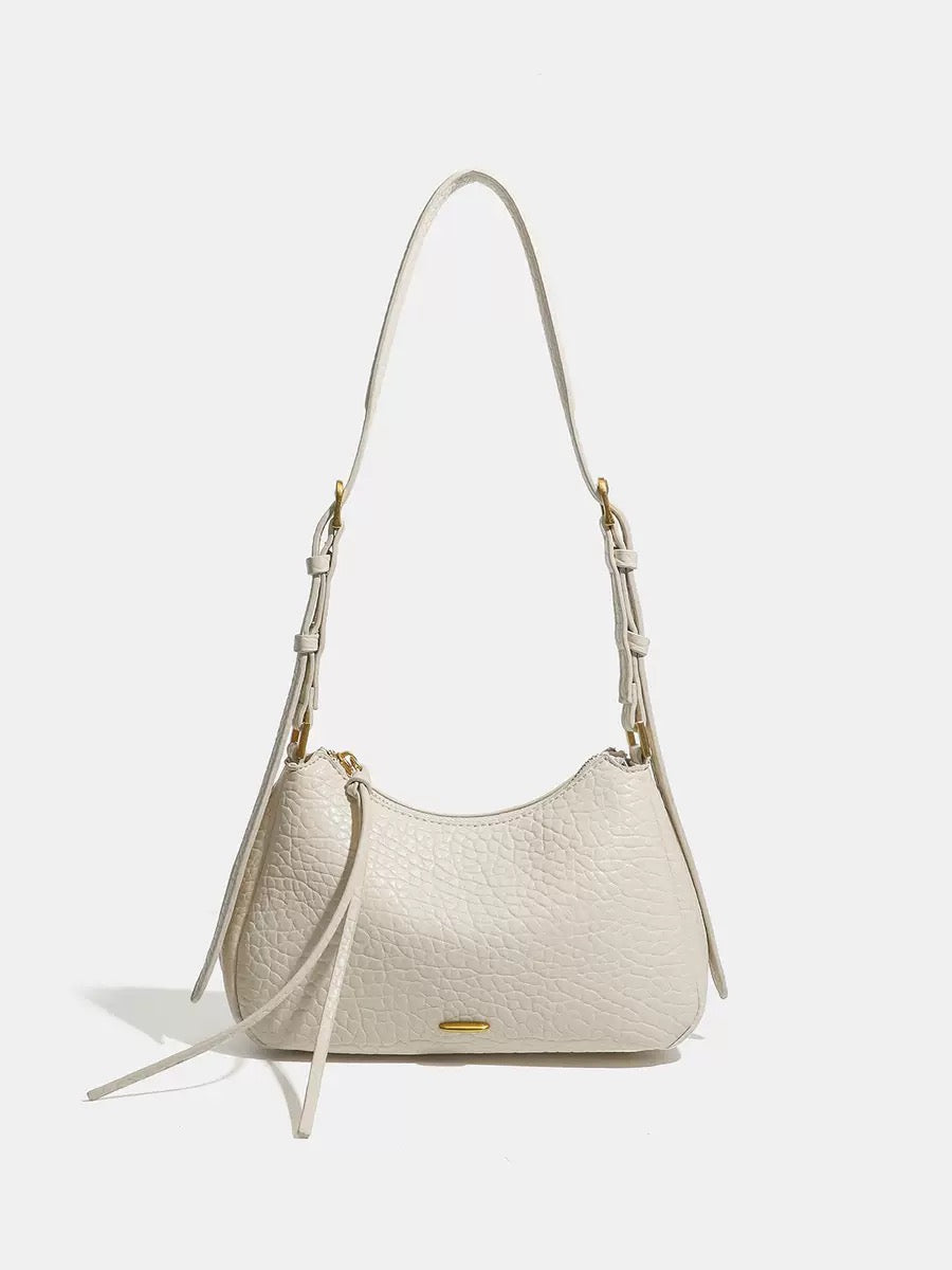 Spring 2026 Relaxed Simple Hobo – The Effortless Petite Underarm Bag  Best for: High-end boutiques or brand websites where a clean, sophisticated look is preferred over keyword-heavy descriptions