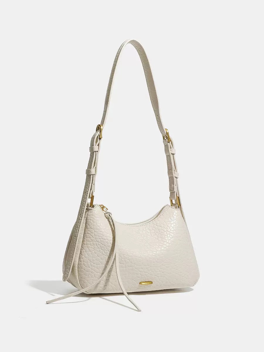 Spring 2026 Relaxed Simple Hobo – The Effortless Petite Underarm Bag  Best for: High-end boutiques or brand websites where a clean, sophisticated look is preferred over keyword-heavy descriptions