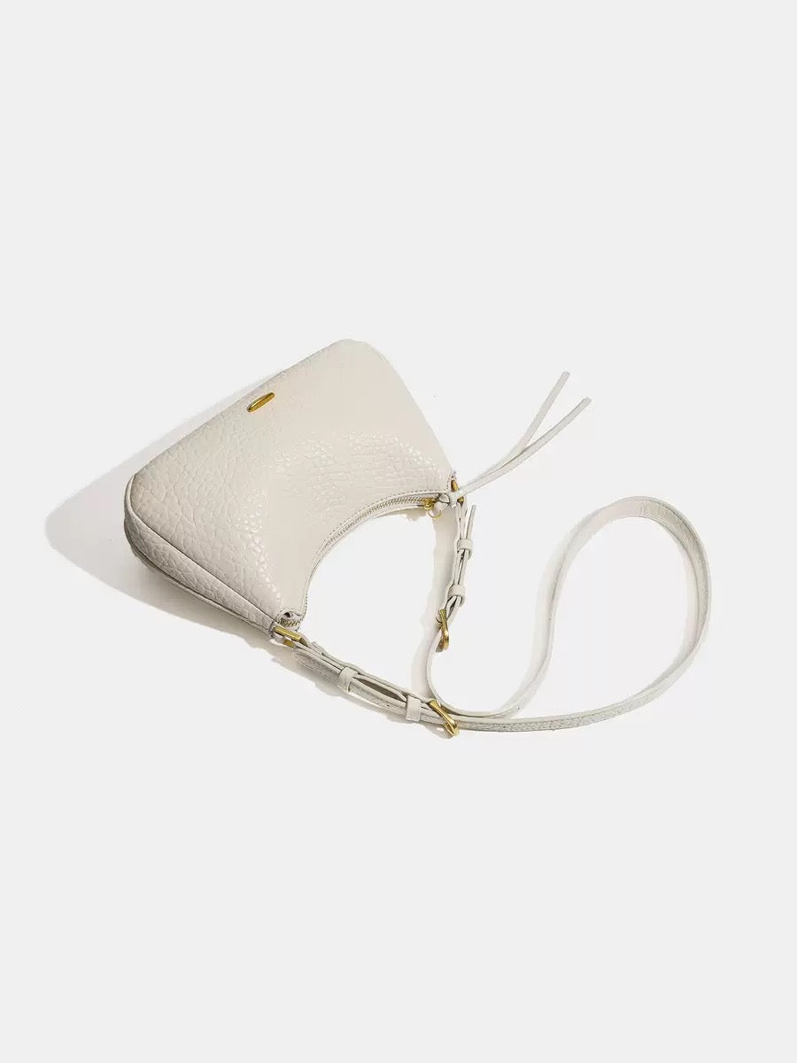 Spring 2026 Relaxed Simple Hobo – The Effortless Petite Underarm Bag  Best for: High-end boutiques or brand websites where a clean, sophisticated look is preferred over keyword-heavy descriptions