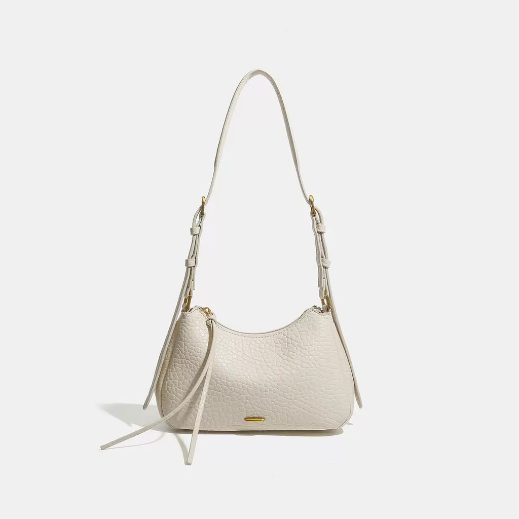 Spring 2026 Relaxed Simple Hobo – The Effortless Petite Underarm Bag  Best for: High-end boutiques or brand websites where a clean, sophisticated look is preferred over keyword-heavy descriptions